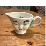 Ceramic Bailey Novelty Creamer With Face Design, White Blue Handle, 'yum.' Int. Fixed Price $11.00.