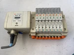 Lot Of 8 Smc Solenoid Valve SV1A00-5FU W/ Block And EX250-SDN1 Device Net. Fixed Price $215.00.