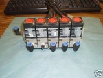 Bank Koganei V100EI Pneumatic Valves On Manifold. Fixed Price $54.99.